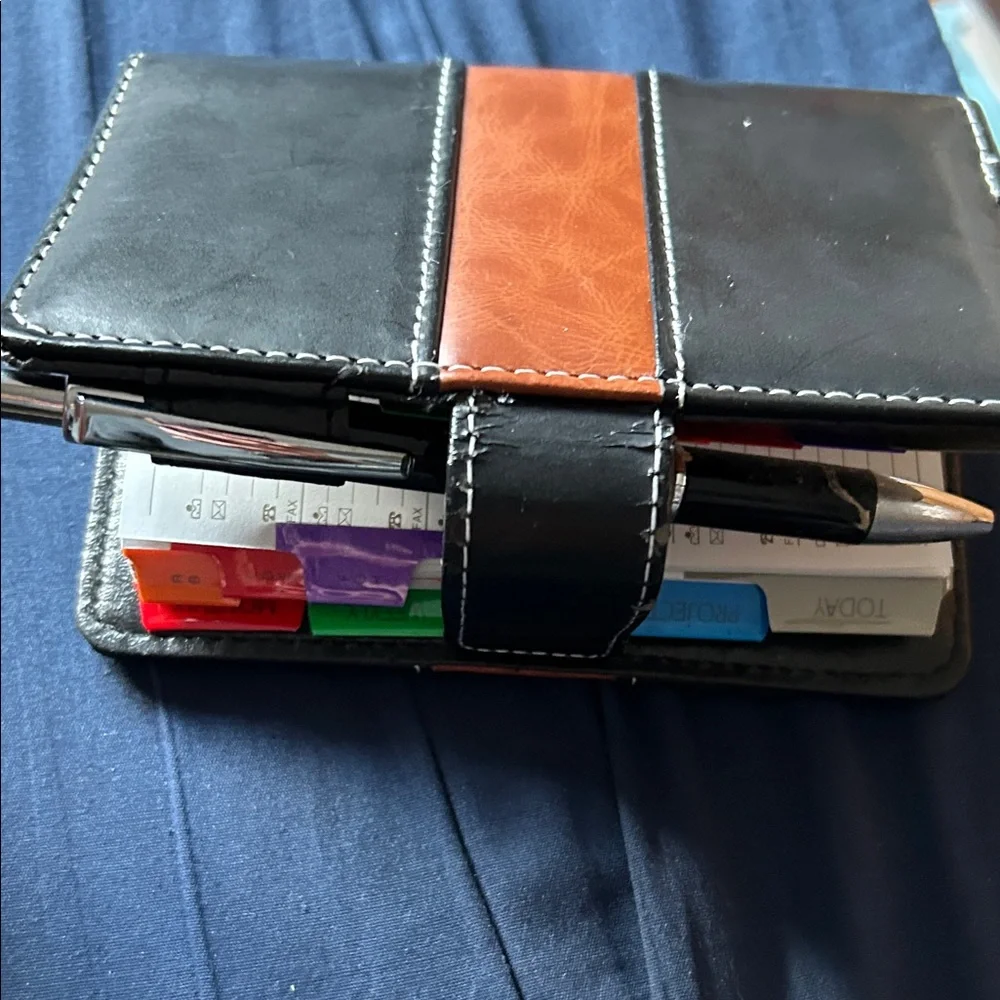 Black and Brown planner with the pen